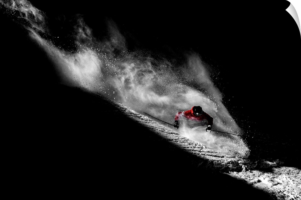 Guerlain Chicherit skis down a mountain in Tignes, France, in a shaft of light.
