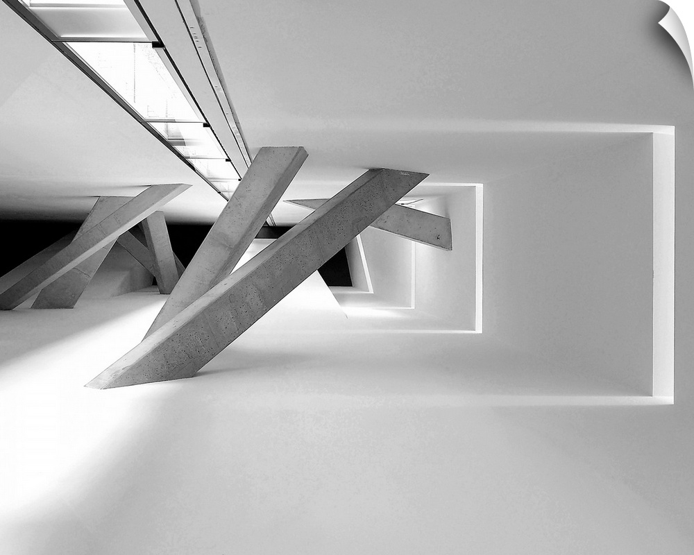 Hallway with concrete pillars at different angles connecting the walls, creating an abstract image.