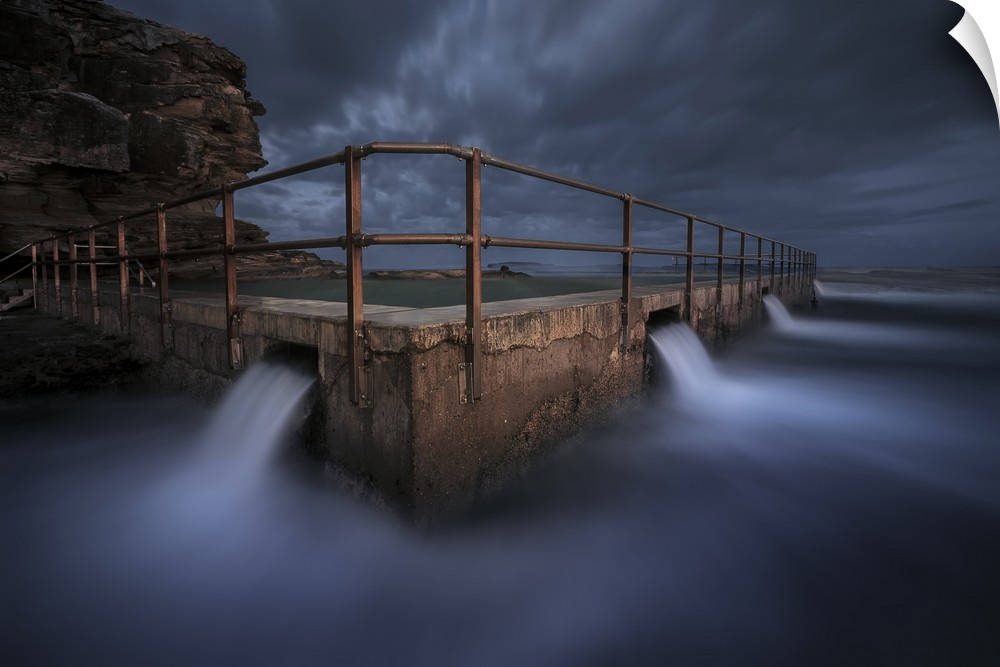 Long exposure landscape photograph of the North Curl Rock Pool at night, Australia.