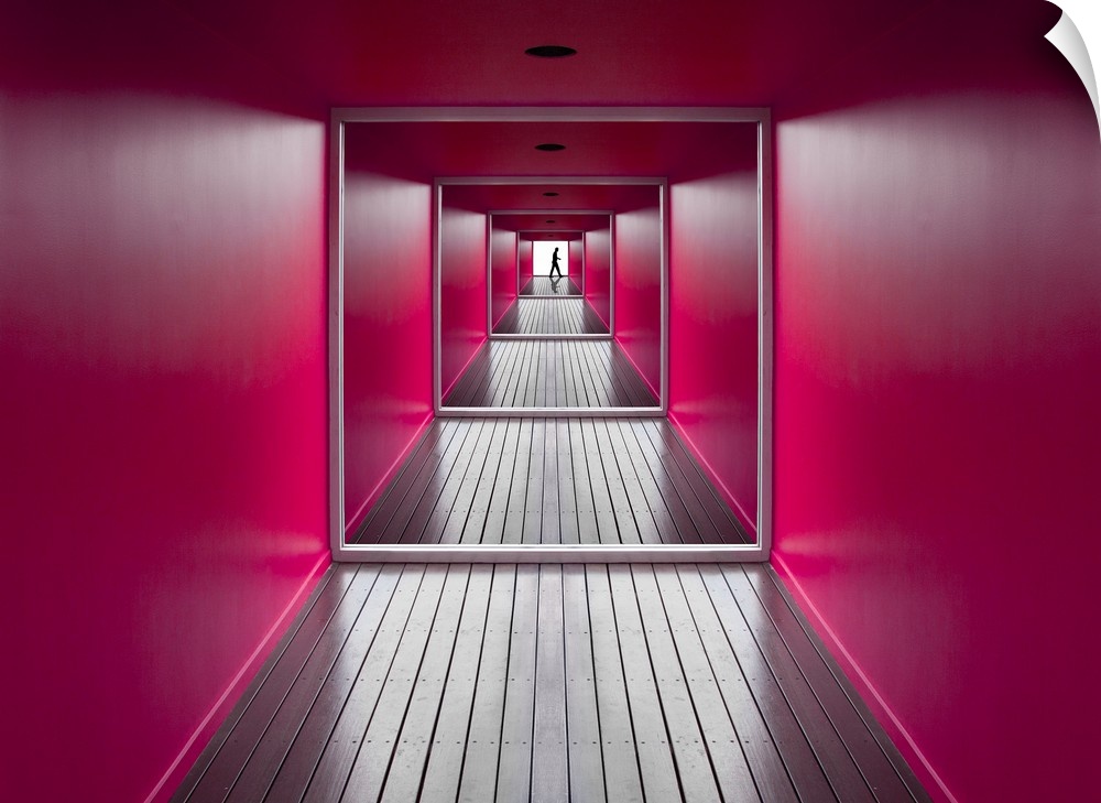 A square shaped hallway with bright pink walls, and a figure at the exit.