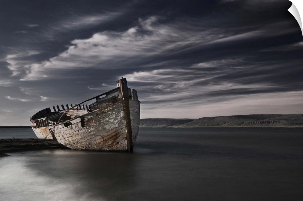 Abandoned and decaying boat hull on the beach, Snaefellsnes Peninsula, Iceland.