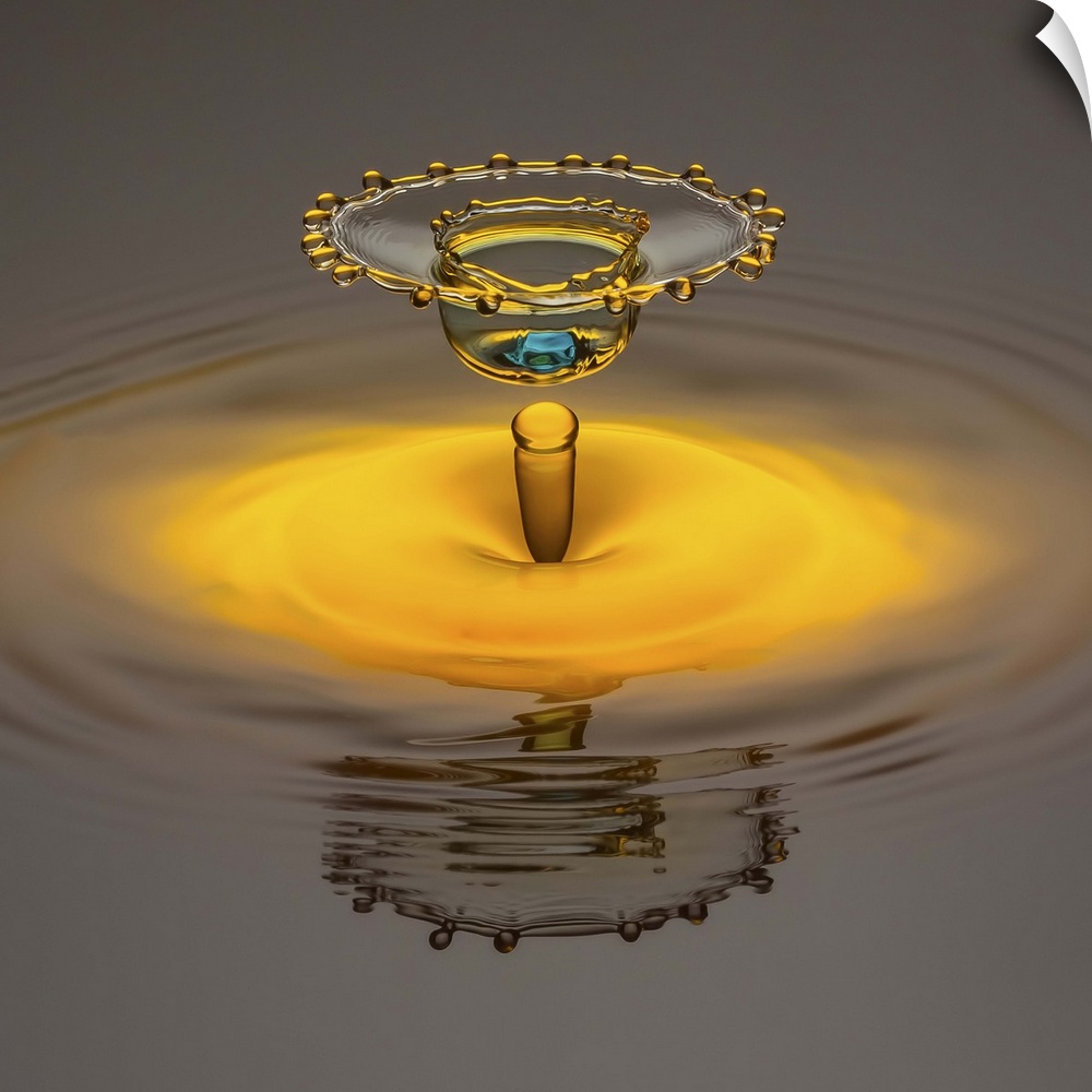 A water droplet creating abstract shapes as it splashes.