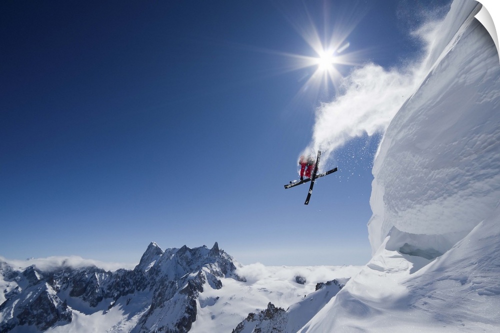 Skier Guerlain Chicherit jumping off a snowy cliff, Chamonix, France