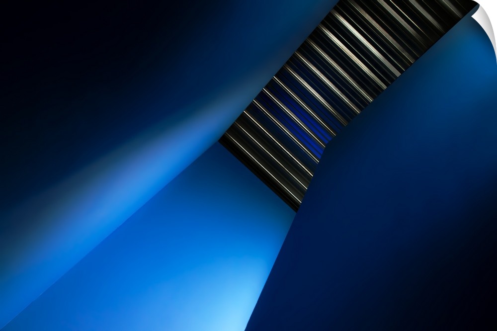 A stairwell in a hallway with blue walls.