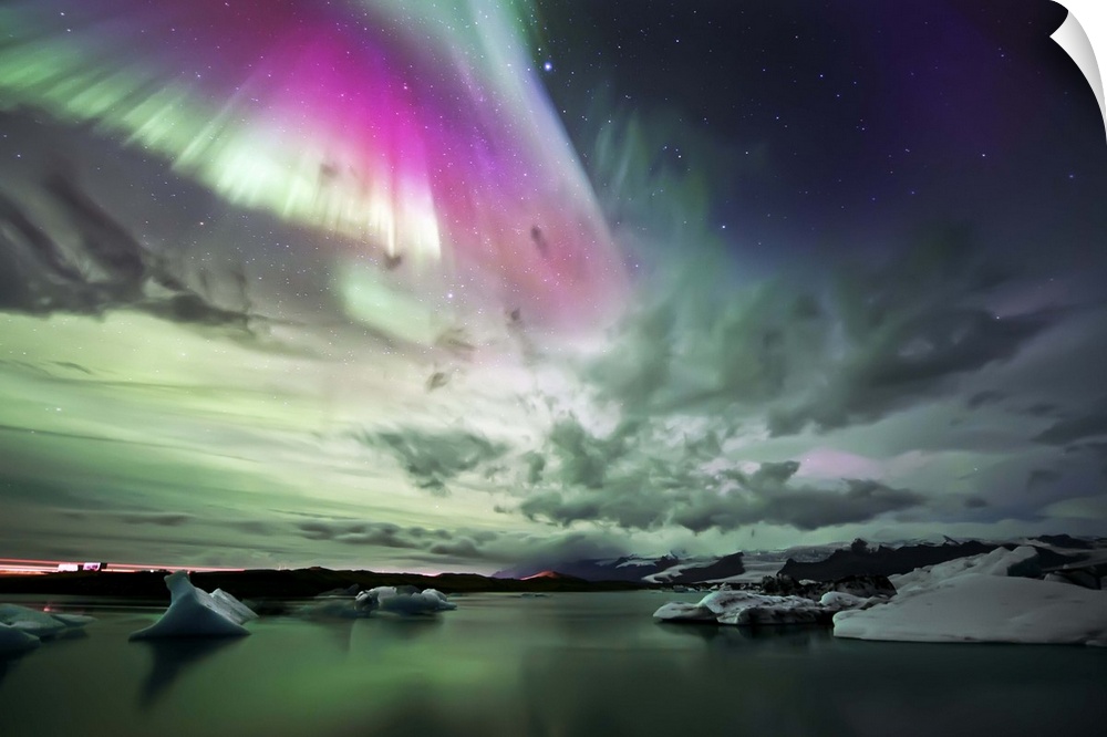 Stunning northern lights display over the glaciers in Jokulsarlon Lake in Iceland.