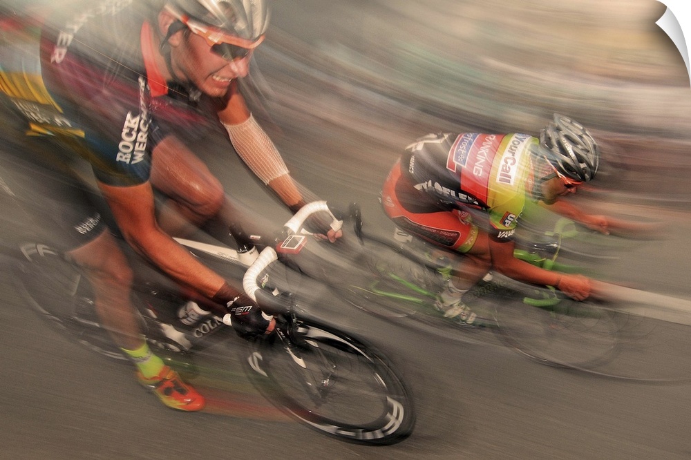 Action shot of cyclist racing at full speed.