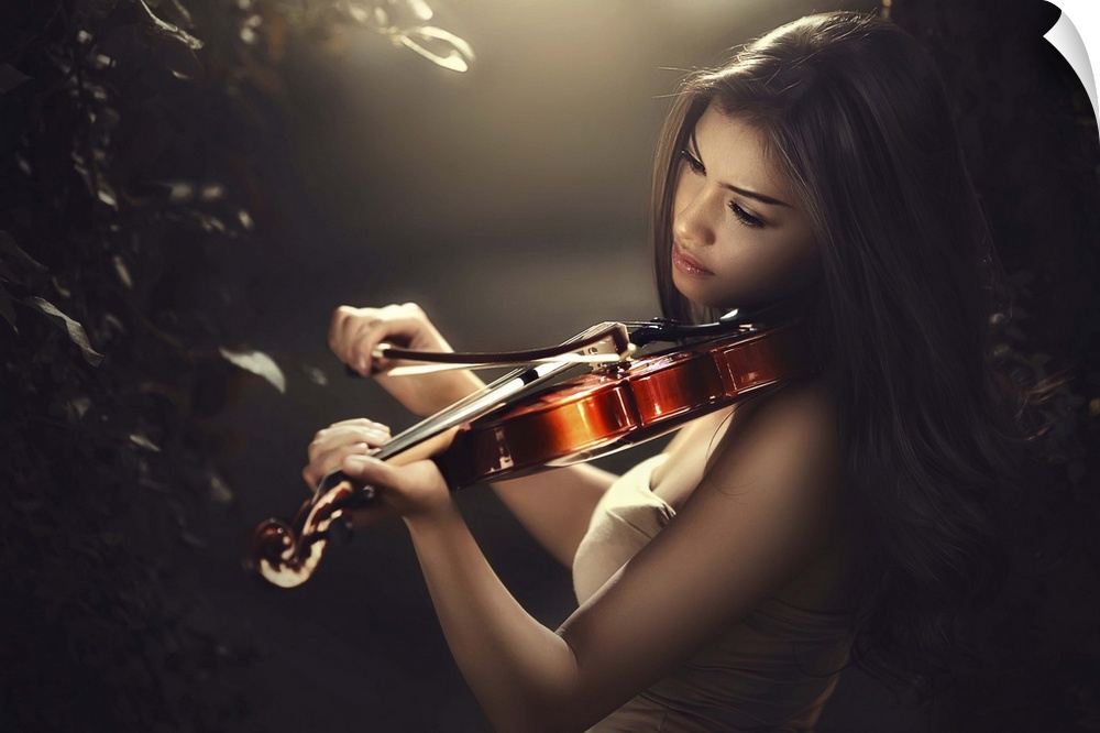 A beautiful woman with long dark hair playing a violin.