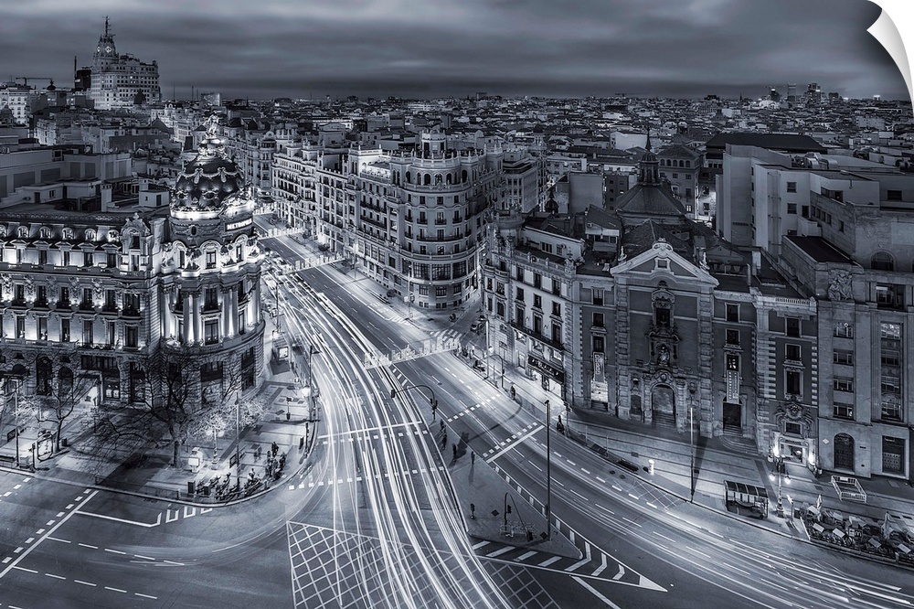 A photograph of Madrid with light trails covering the roads, Spain.