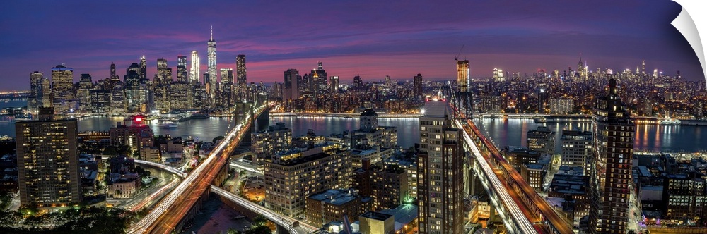 View over Manhattan and Brooklyn skyline during sunset.