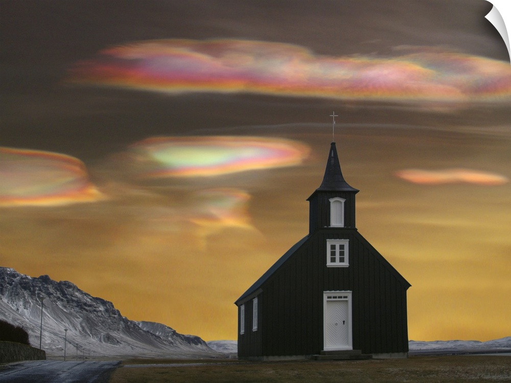A church in Iceland with Polar stratospheric clouds, also known as nacreous clouds or "glitsky," which are clouds found in...