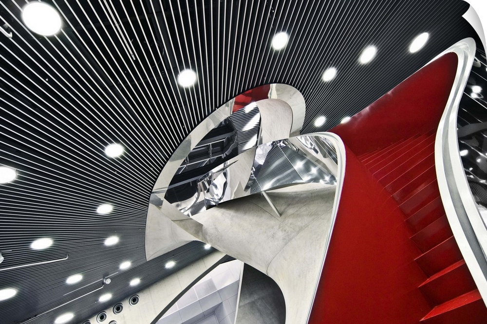 Lights and mirrors surrounding the red staircase in the MUMUTH, Graz, Austria.