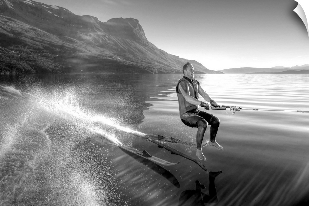 A waterskier at the moment when his skis have fallen off his feet.