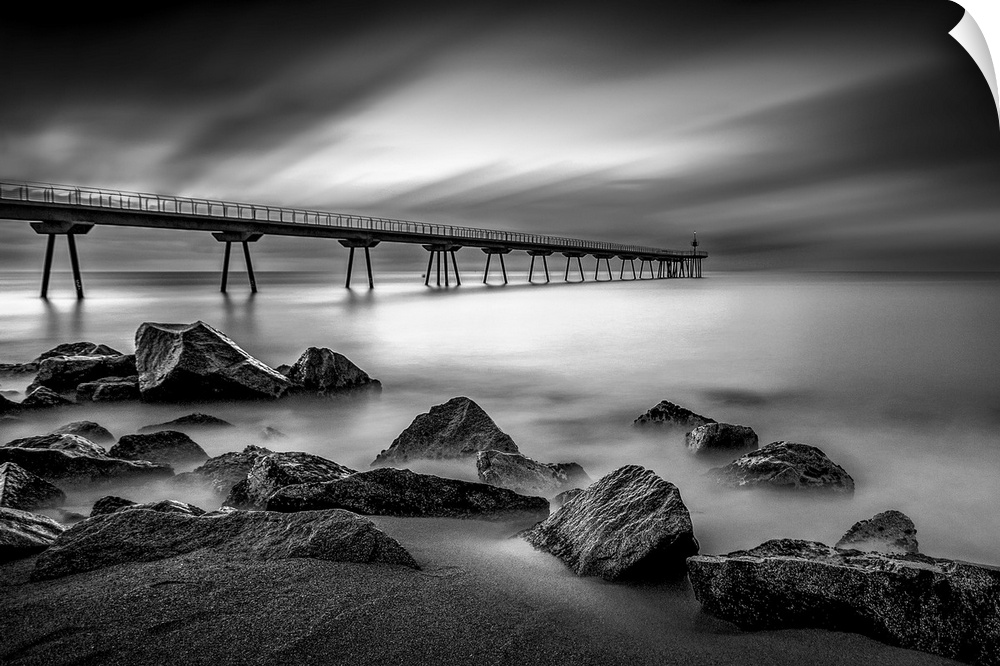 Long exposure black and white photograph of a seascape in Pint Del Petroli, Spain.