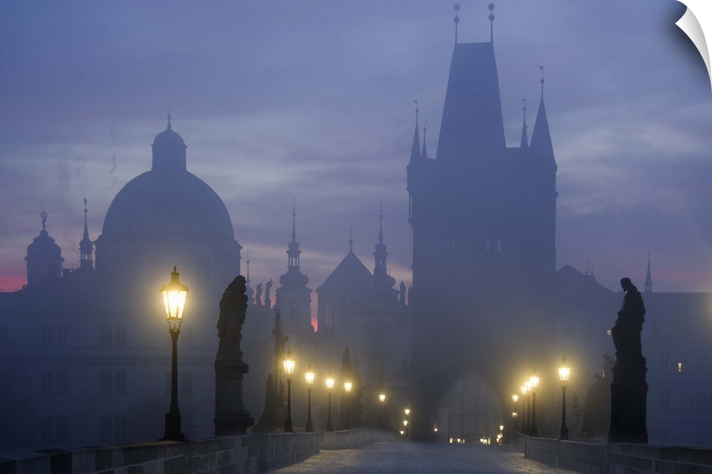 Charles Bridge in Prague in the early morning mist.