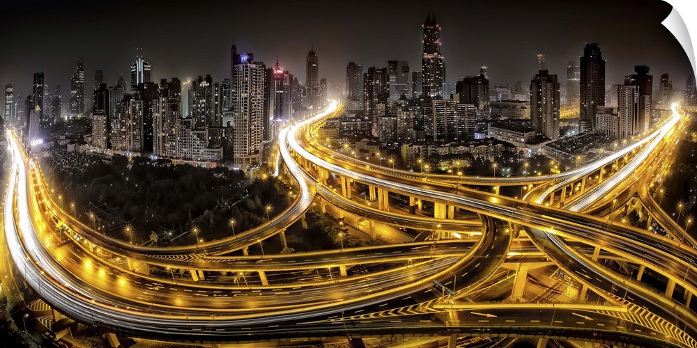 Shanghai city skyline with intersecting highways glowing with light trails from zooming cars.