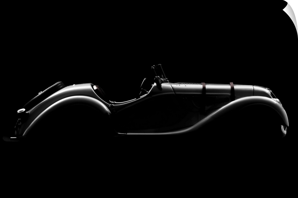 A BMW 328 Roadster in high contrast lighting creating a smooth outline.
