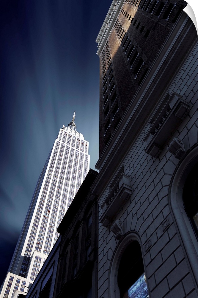Looking up at the Empire State Building from the ground level, NYC.