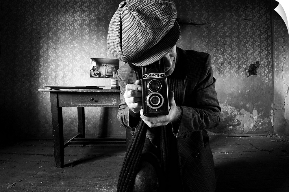 A man taking a photo with a vintage film camera in an abandoned room with peeling wallpaper.