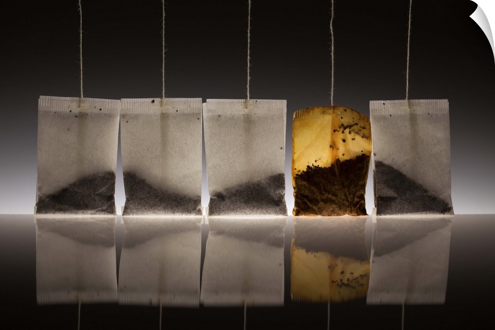 A conceptual photograph of a teabags with the tea leaves arranged in such a way to resemble a mountain scape.