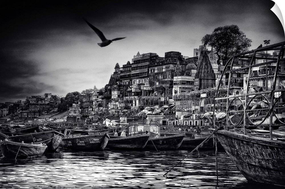 Several boats in a harbor on the Ganges river in Varanasi, India.