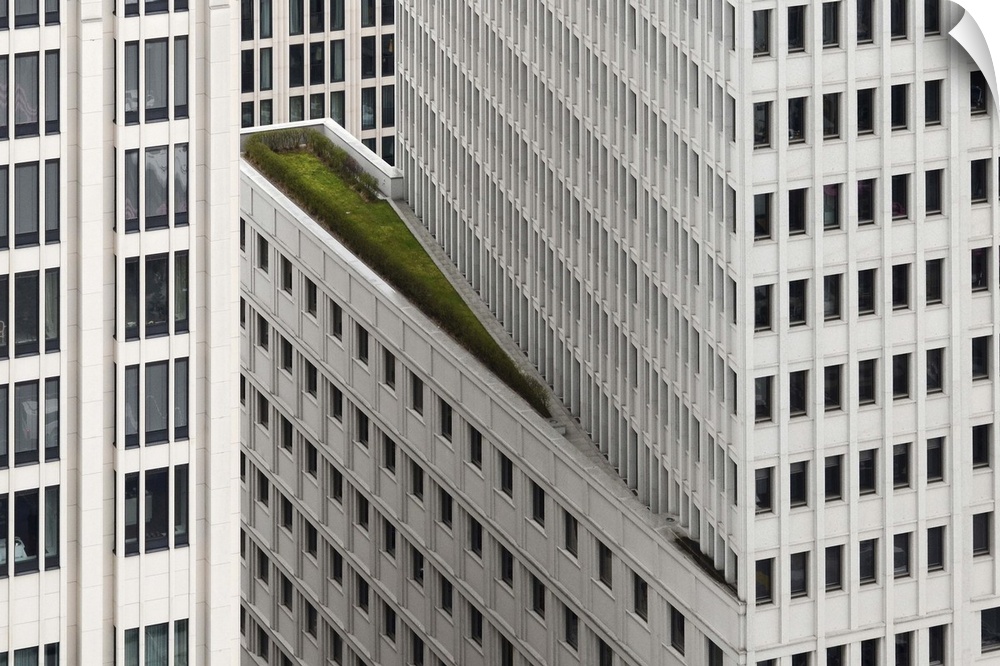 A balcony on the side of a skyscraper with greenery, Berlin, Germany.