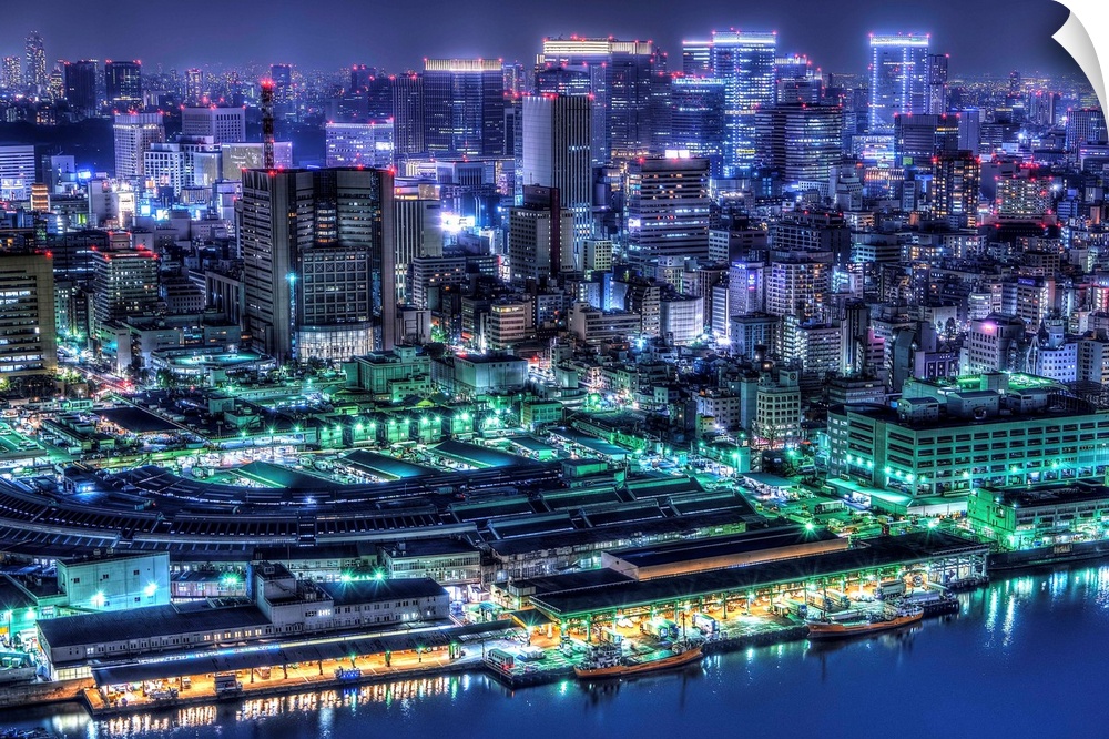 A photograph of the cityscape of Tokyo at night lit up in neon lights, Japan.
