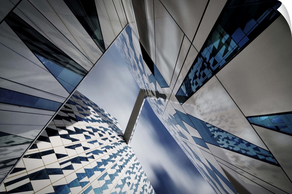 Glass facades of skyscrapers creating abstract patterns with their reflections.