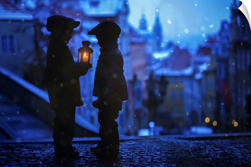 Silhouettes of children facing each other with one holding a lantern at night in winter.