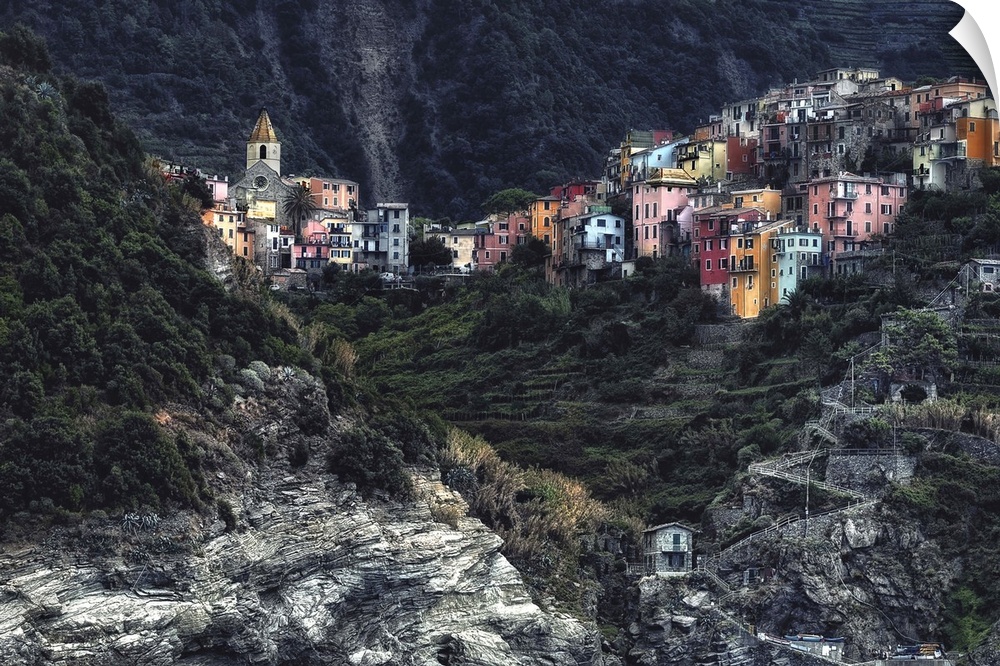Colorful buildings nestled in the rocky slopes of Cinque Terre, Italy.