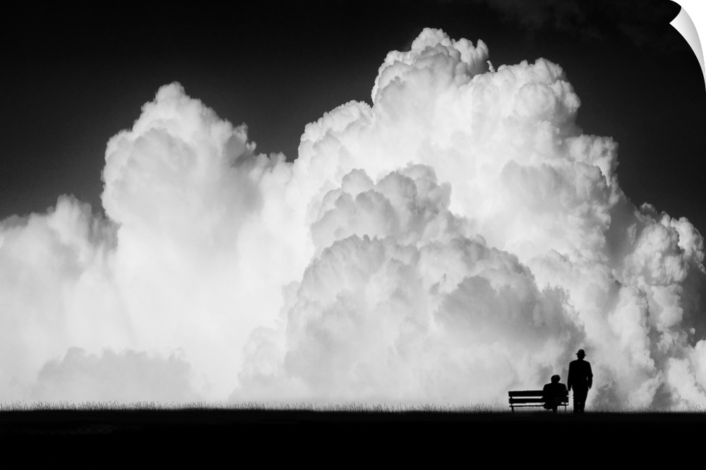Figures and a bench dwarfed by gigantic stormclouds in the sky.