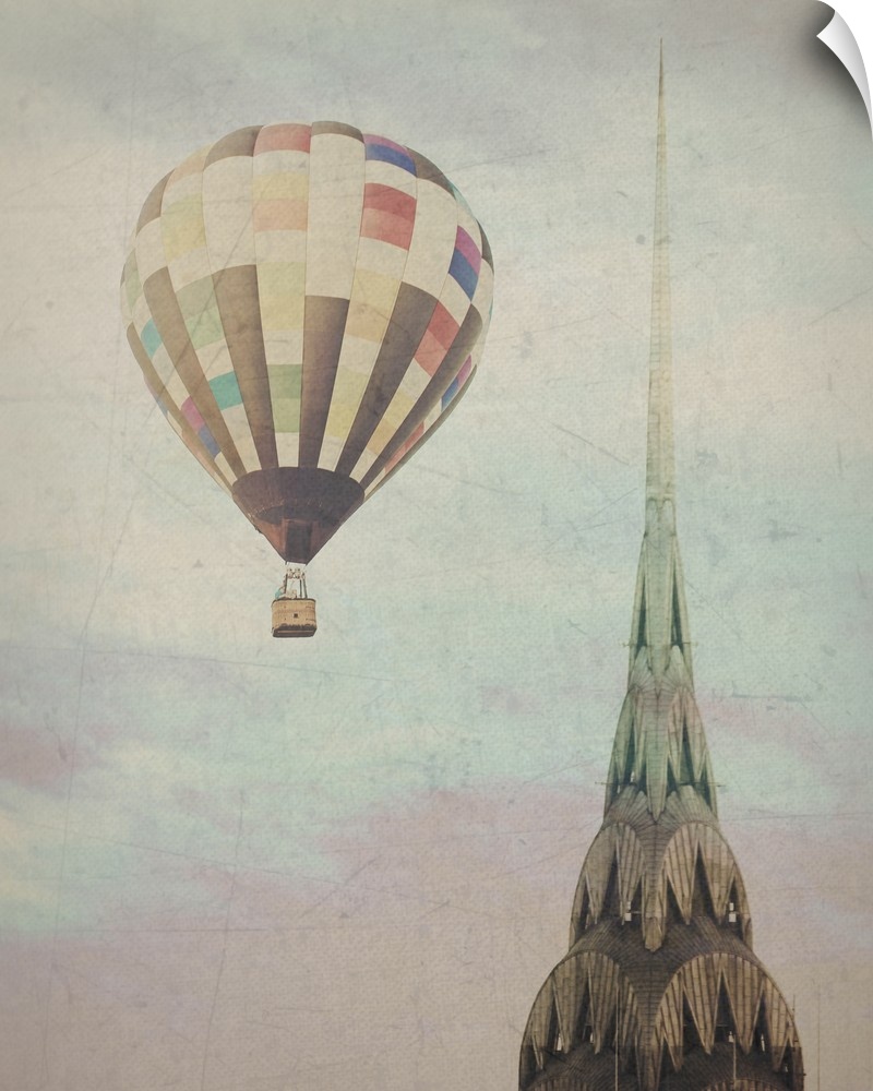 Artistically filtered photograph of the Chrysler building in NYC, with a hot air balloon in the sky.