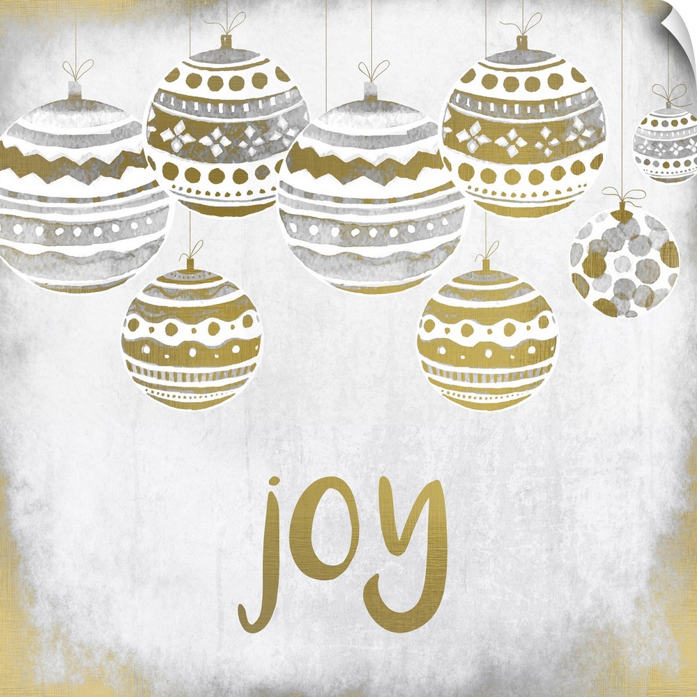 Gold and silver holiday ornaments hanging over the word "Joy."