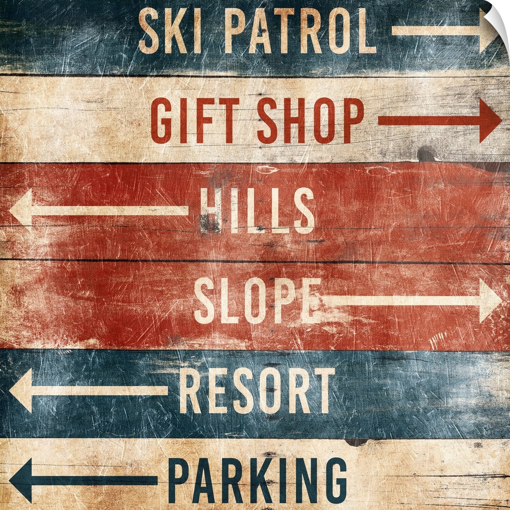 A wooden sign with arrows pointing the way to area at a ski resort.