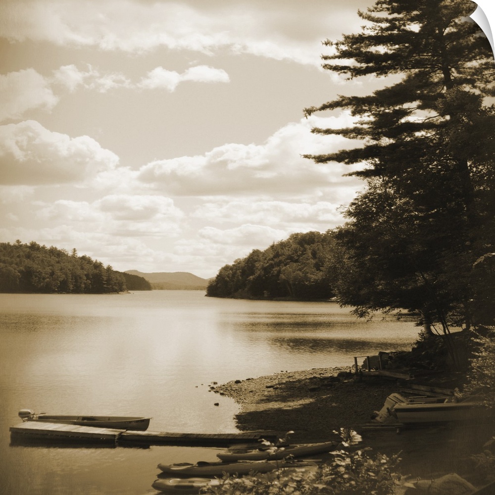Sepia toned photograph of an idyllic wilderness scene, with lake and forest.