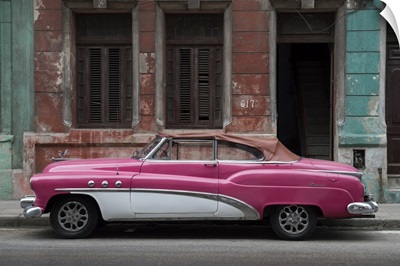 1950s Classic American Pink Car Set Against A Traditional Cuban House
