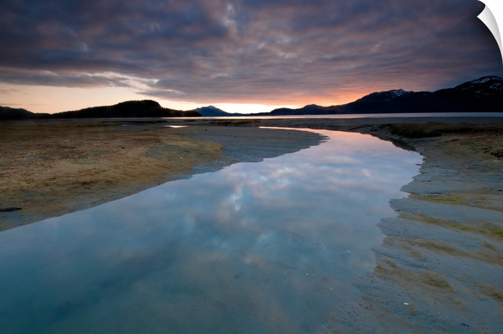 Evening sky reflects on the incoming tide at Harntey Bay near Cordova, Chugach National Forest, Southcentral Alaska, Spring