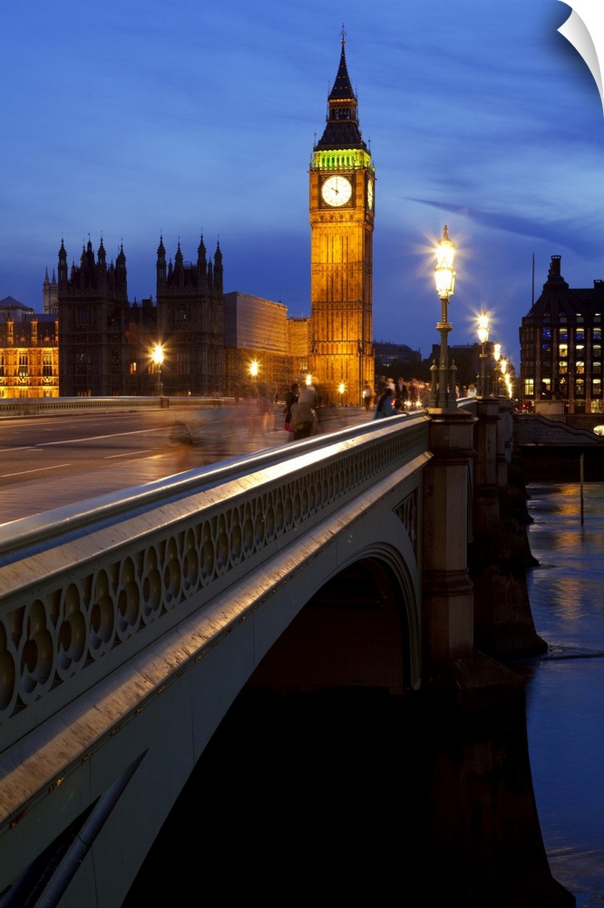 A night view across Westminster Bridge with Big Ben in the distance.