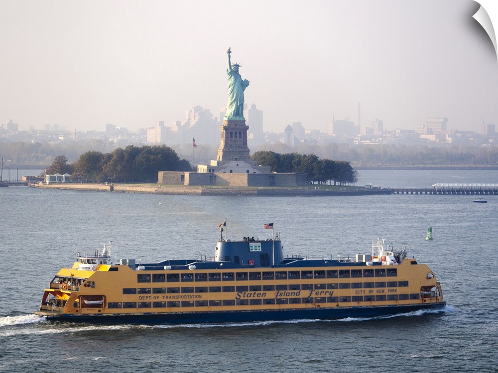 A Staten Island ferry passing the Statue of Liberty.
