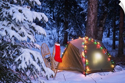 A Tent Set Up In The Woods With Christmas Lights And Stocking Near Anchorage, Alaska