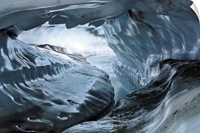 A water channel cuts a tunnel through the ice of the Matanuska Glacier