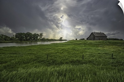 Abandoned Barn With Storm Clouds Converging Overhead, Nebraska, United States Of America