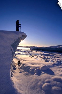 Alaska, Juneau, Mendenhall Glacier, Nordic Skier Stands On Cliff At Sunset