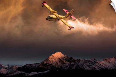 An Aircraft Dropping Water On A Forest Fire In The Mountains Below