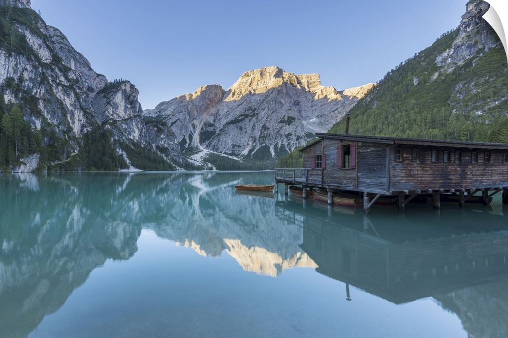 Boathouse with Croda del Becco (Seekofel) reflected in Braies Lake (Lago di Braies) in the Bolzano Province (South Tyrol) ...