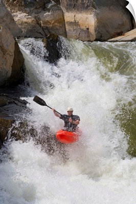 C-1 paddler goes down the Spout, the Virginia side of Great Falls on the Potomac River; Great Falls, Virginia, United States of America