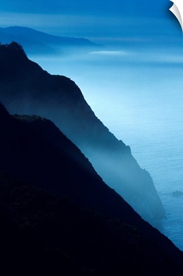 California, Big Sur Coast, Silhouetted Cliffs Along Foggy Ocean Shoreline