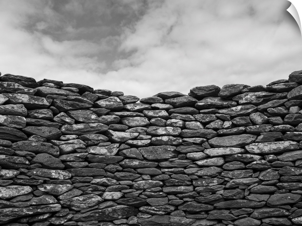 Close-up of a stone wall and clouds in the sky, Ballyferriter, county Kerry, Ireland.