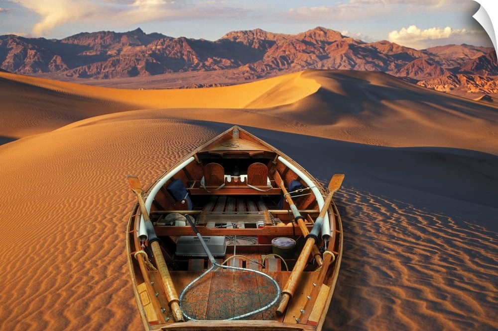 Drift boat and Death Valley National Park sand dunes. Composite.