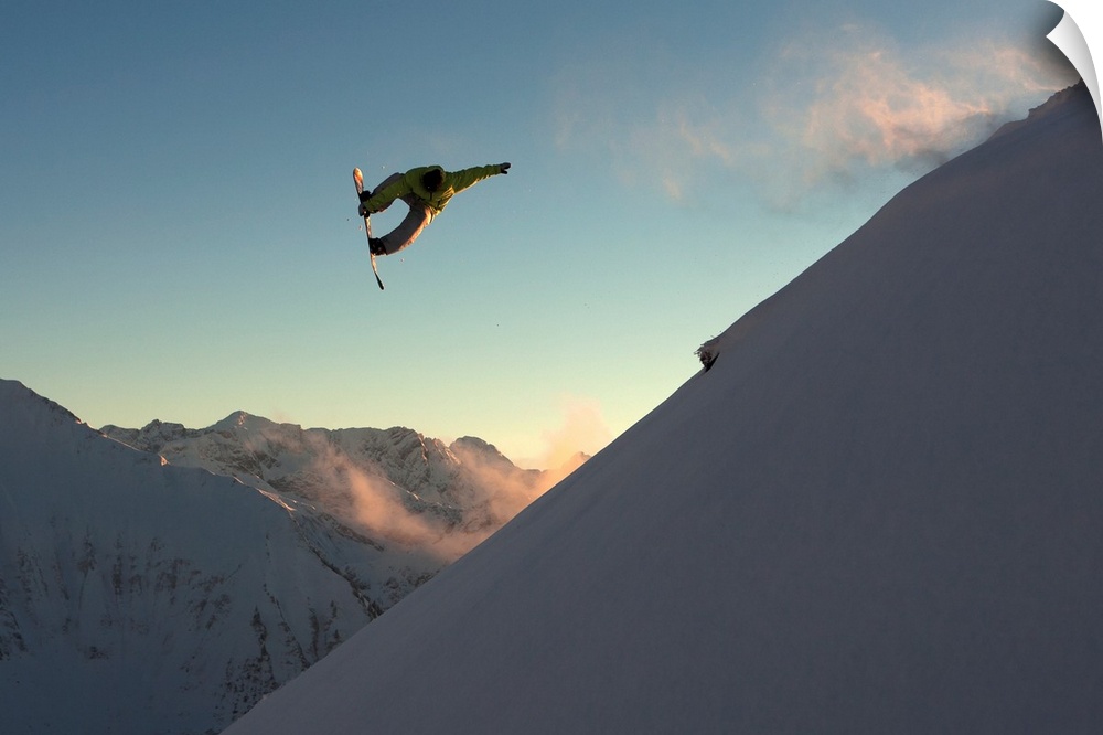Professional snowboarder, Frederik Kalbermatten, extreme snowboarding at sunset, Arlberg, Austria.