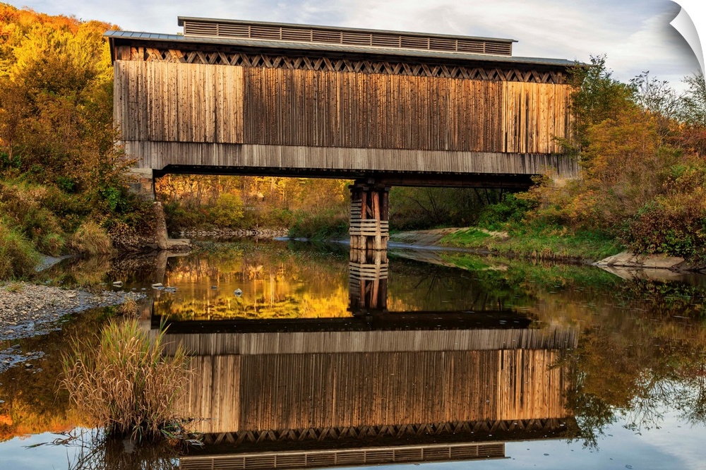 Fisher covered railroad bridge over Lamoille River in autumn, Wolcott, Vermont, United States of America.
